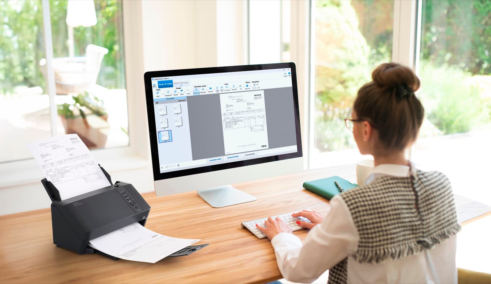 A person using a scanner and capture software together